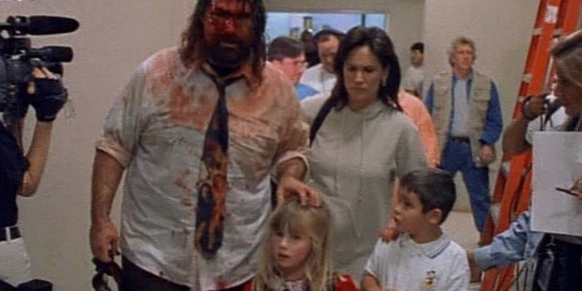 A bloodied Mick Foley walks with his distraught family from Beyond the Mat
