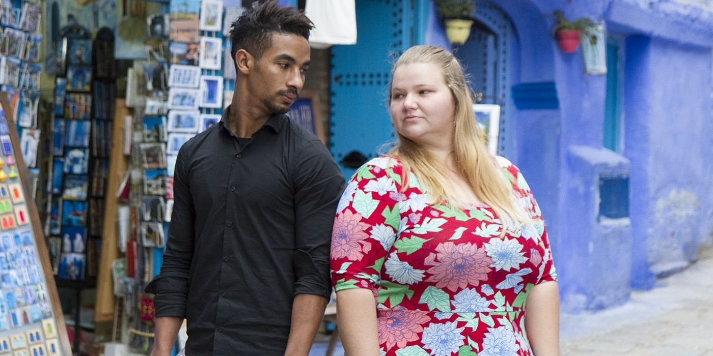 90 Day Fiance Azan and Nicole posing outside in morocco not smiling