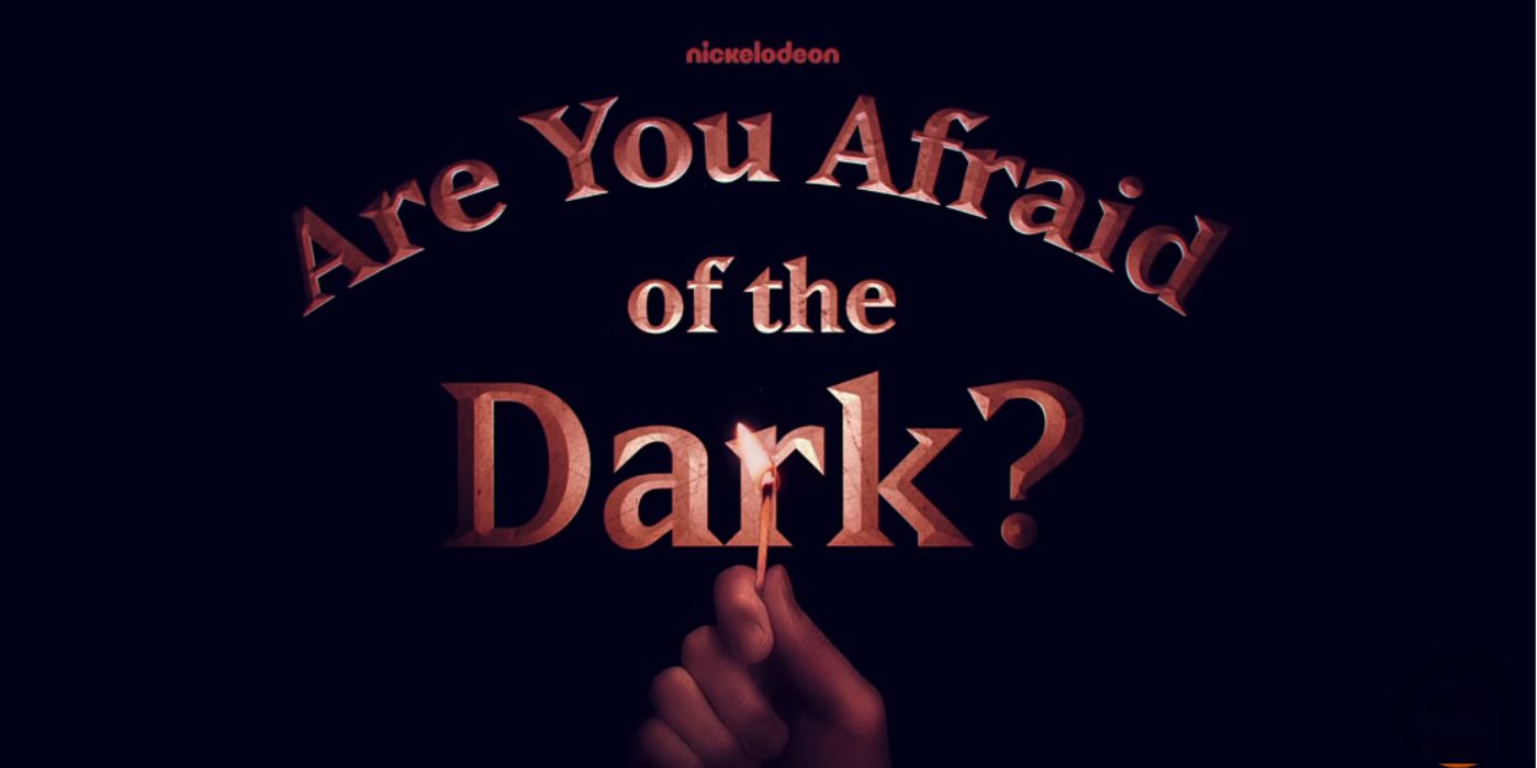 Are You Afraid of the Dark logo with hand holding lit match.