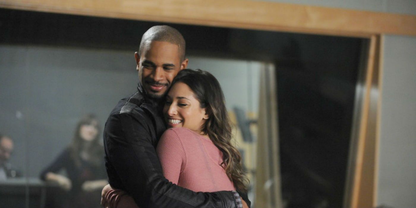 Coach and May hug in New Girl