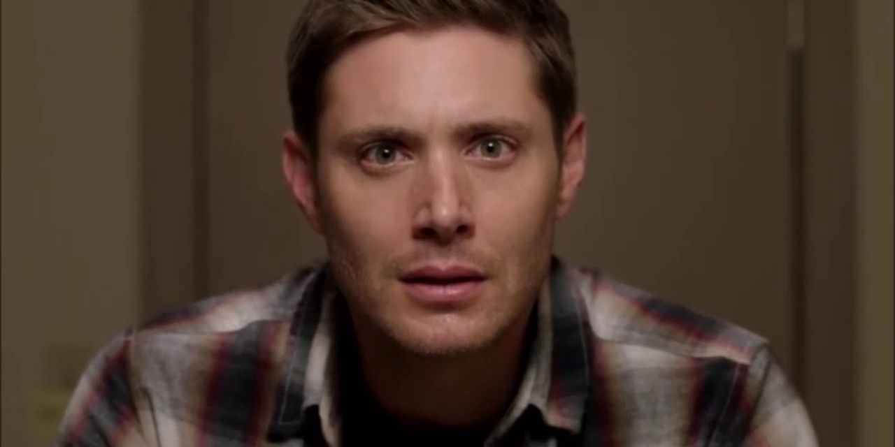 Dean Winchester sadly looking in the mirror in Supernatural