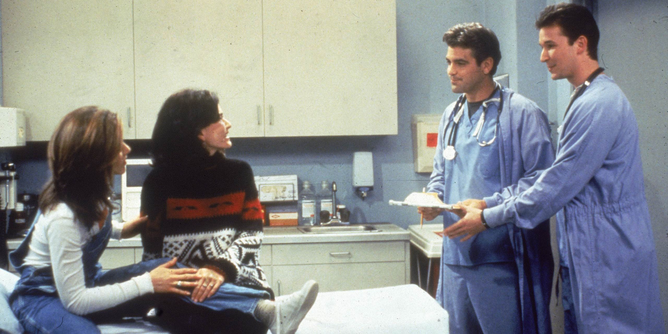 Rachel and Monica in Friends sitting across guest stars George Clooney Noah Wyle at the hospital