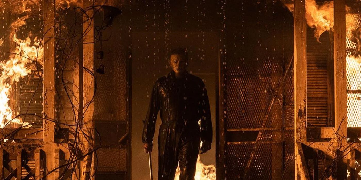 Michael Myers stands in a burning doorway in Halloween Kills