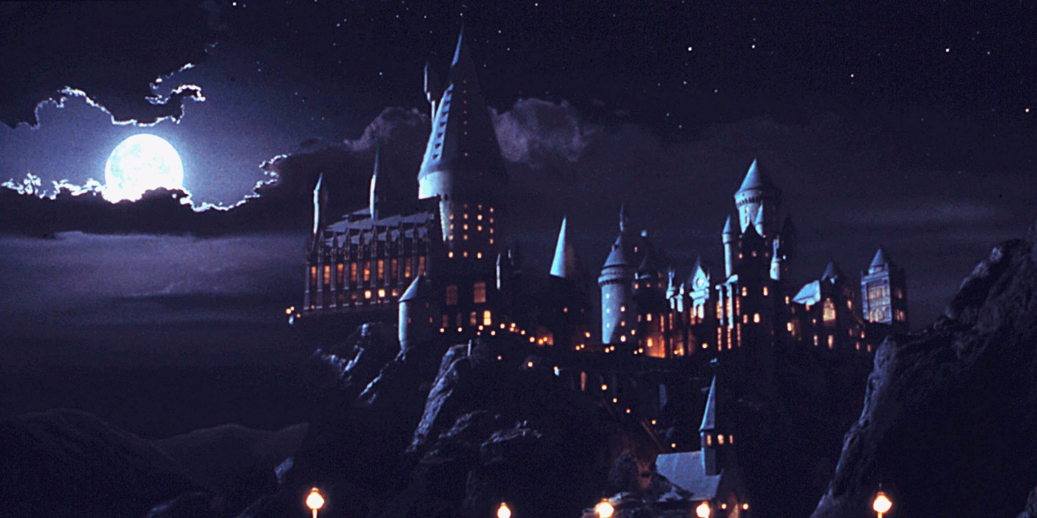 Hogwarts at night with a full moon