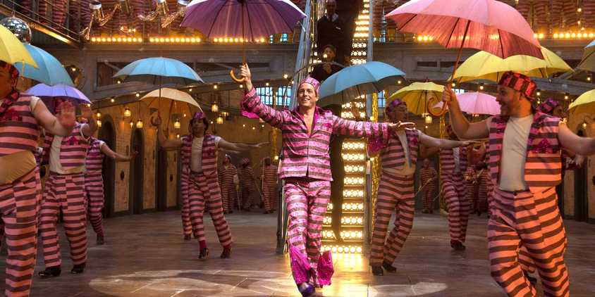 Hugh Grant as Phoenix Buchanan dancing in Paddington 2