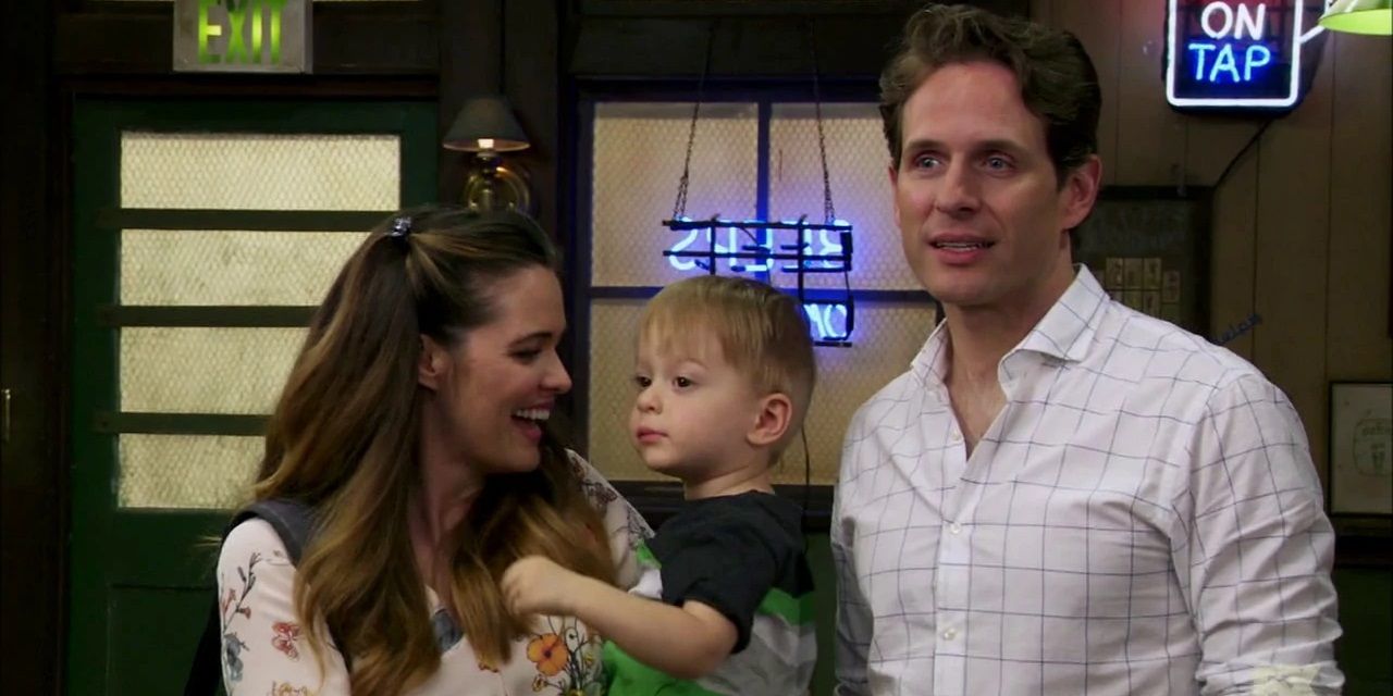 Dennis standing next to his son and lover in It's Always Sunny in Philadelphia.