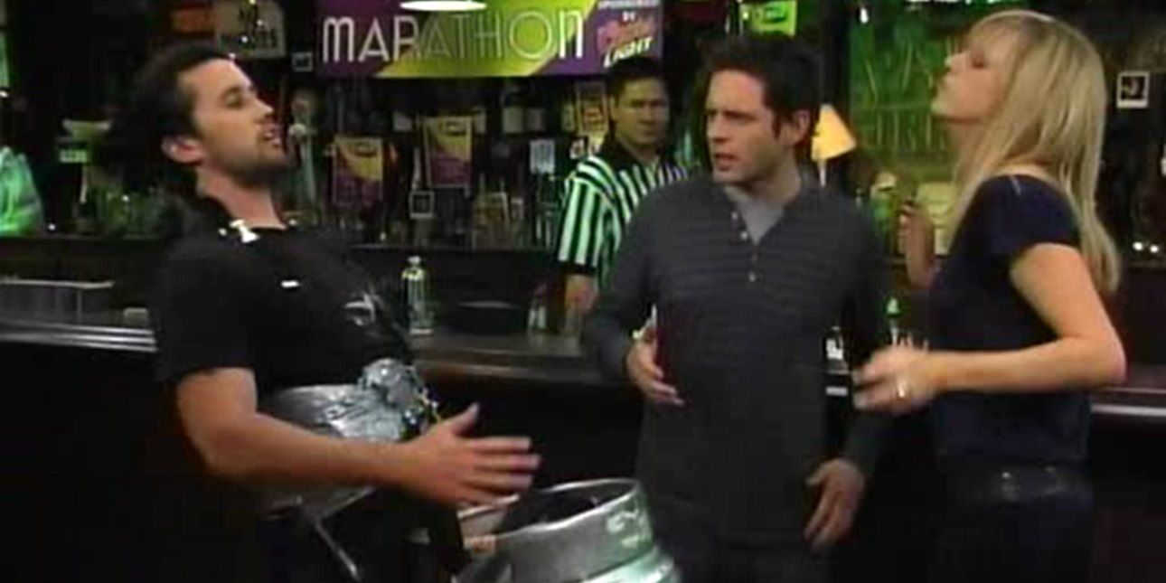 Mac, Dennis, and Dee dancing in front of the bar in It's Always Sunny in Philadelphia.
