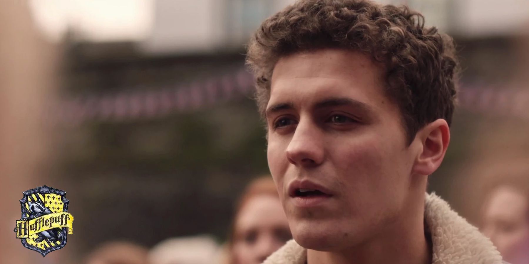 James in Derry Girls with a Hogwarts Hufflepuff house crest in the lower left corner