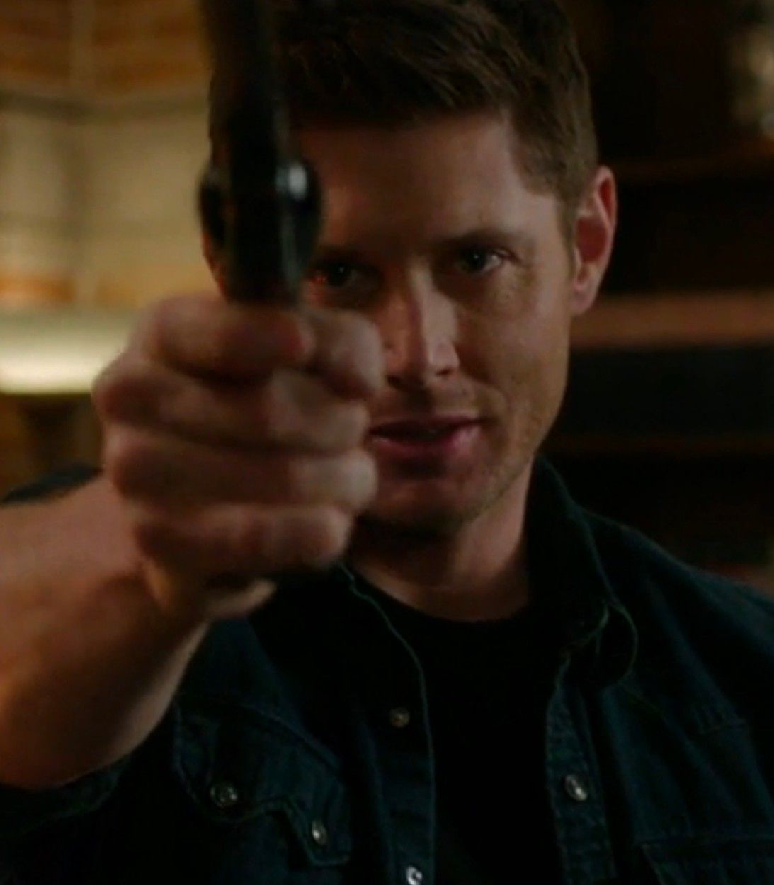 Jensen Ackles as Dean Winchester with Colt in Supernatural vertical