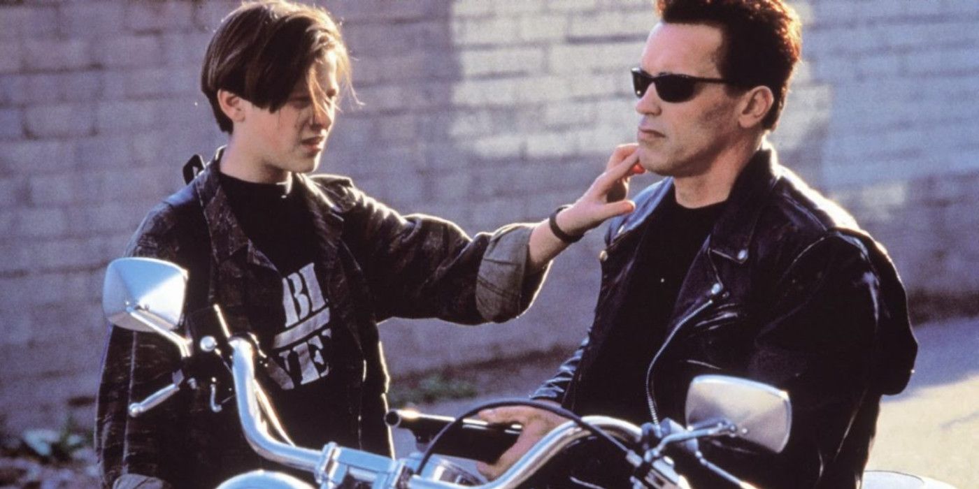 John and the T-800 by a motorcycle in Terminator 2