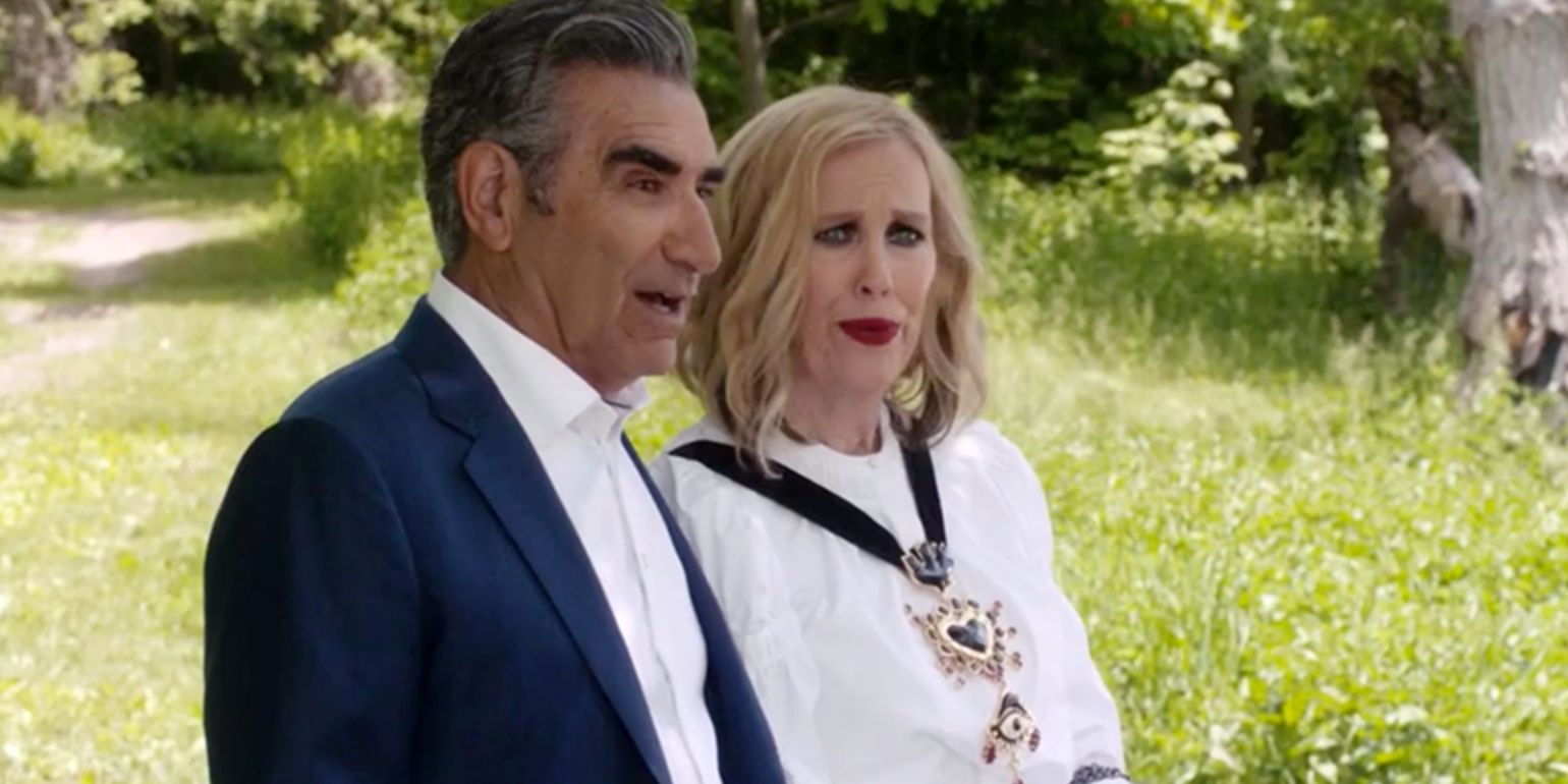 Johnny (Eugene Levy) And Moira (Eugene Levy) in a field in the sun in Schitts Creek Season 6 Premiere