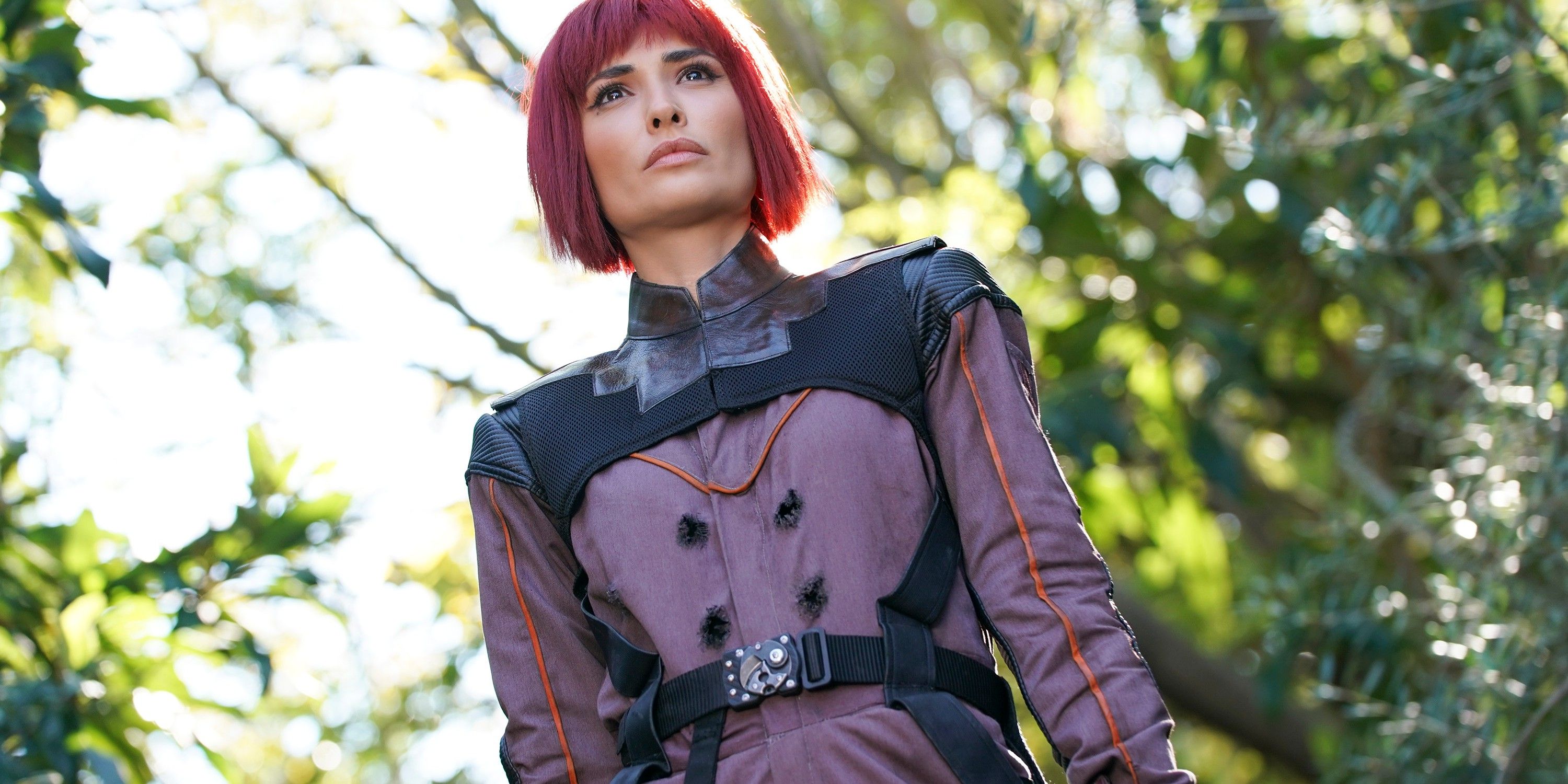 Izel standing in a forest wearing purple space gear in Agents of SHIELD