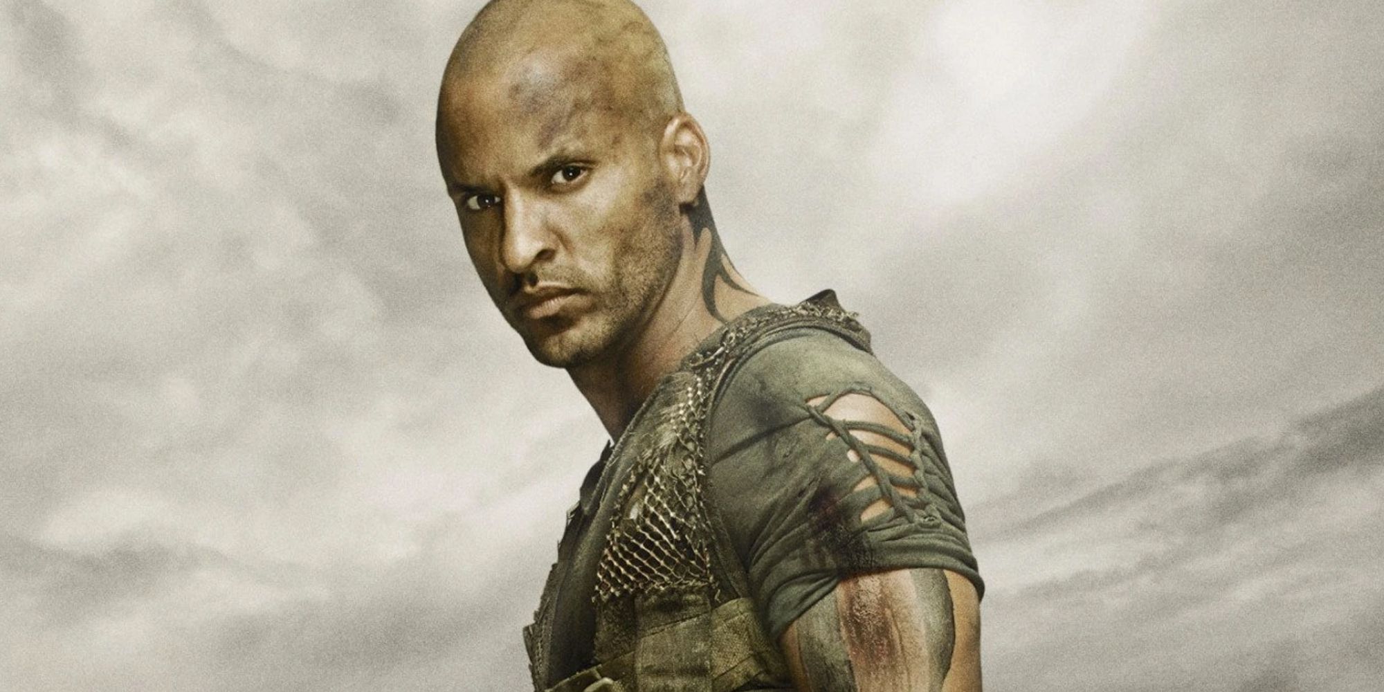Ricky Whittle as Lincoln In The 100 Season 2 promotional photo shoot against a gray sky