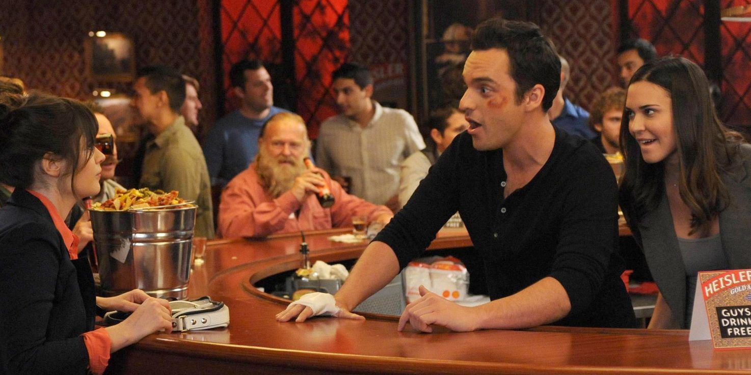 Nick and Shane talking to Jess across the bar In New Girl