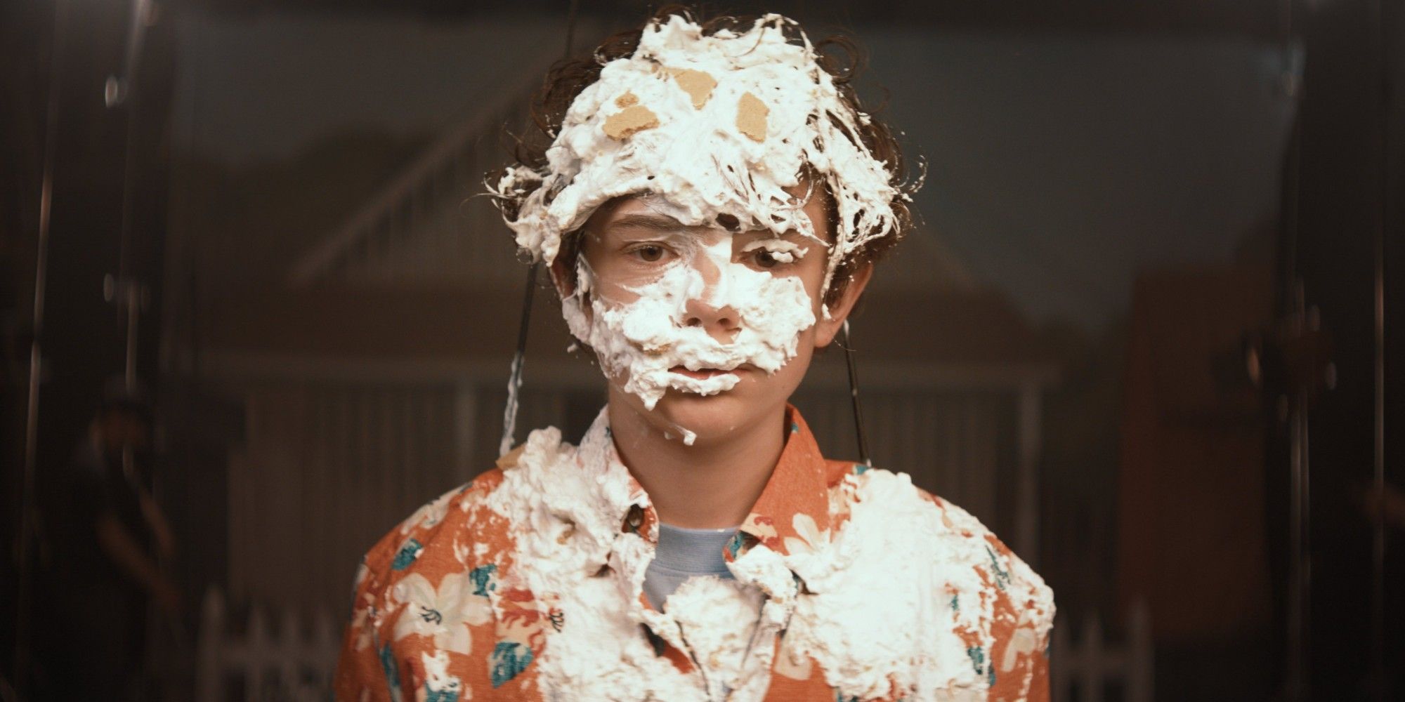 Noah Jupe covered in cake frosting in Honey Boy 2019