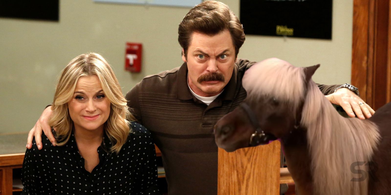 Leslie and Ron with Lil Sebastian Parks and Recreation