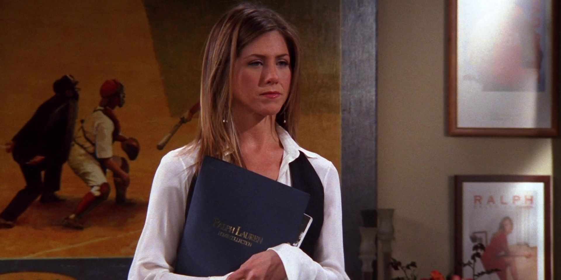 Rachel in her office holding a folder