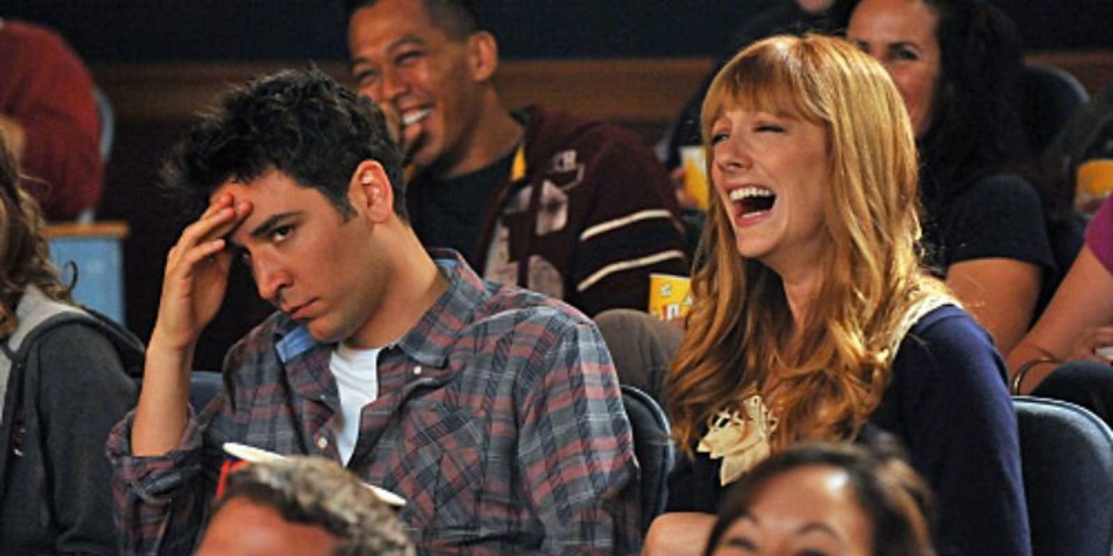 Royce laughing while at the movies with an exasperated Ted in HIMYM