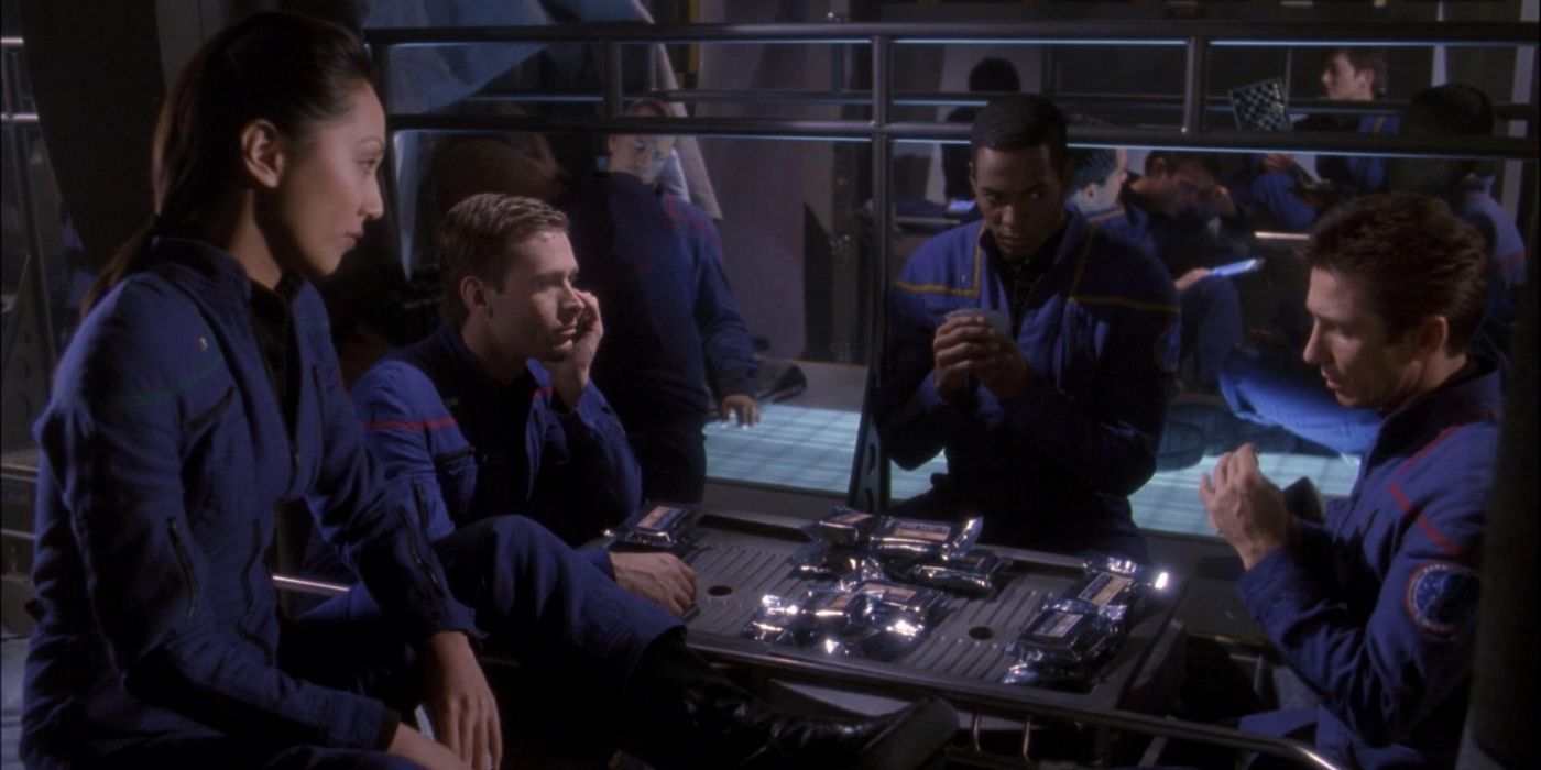 The Enterprise crew sits around a table