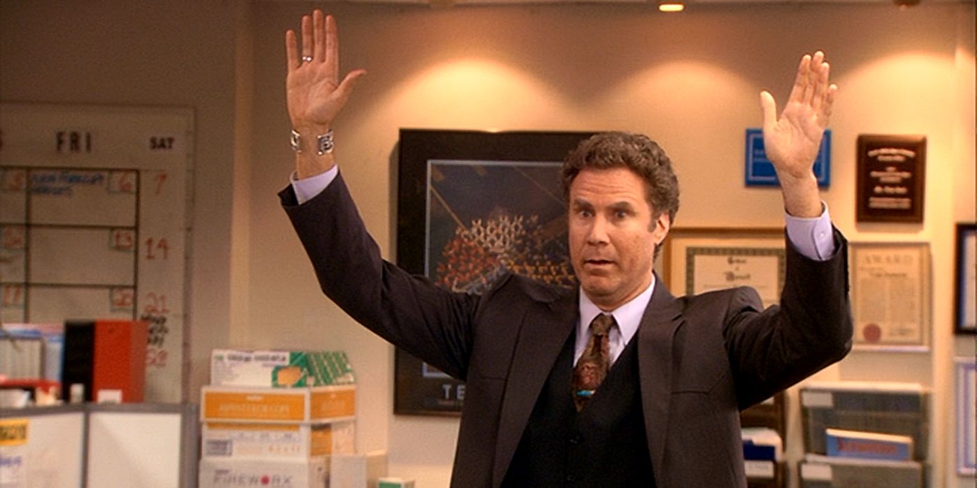 Deangelo holds up his arms to get everybody’s attention in The Office