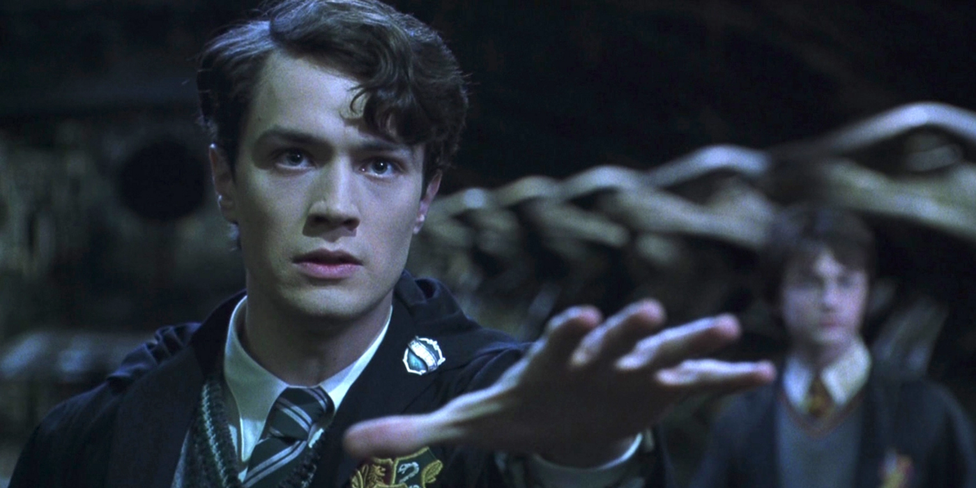 Tom Riddle extending his hand in Harry Potter and the Chamber of Secrets