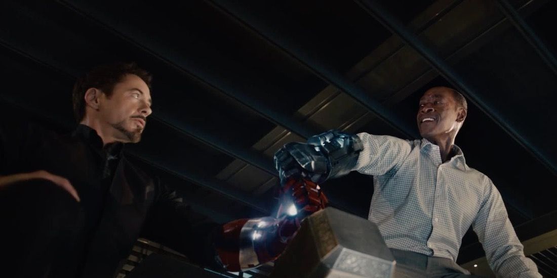 Tony and Rhodey try to pick up Thor's hammer