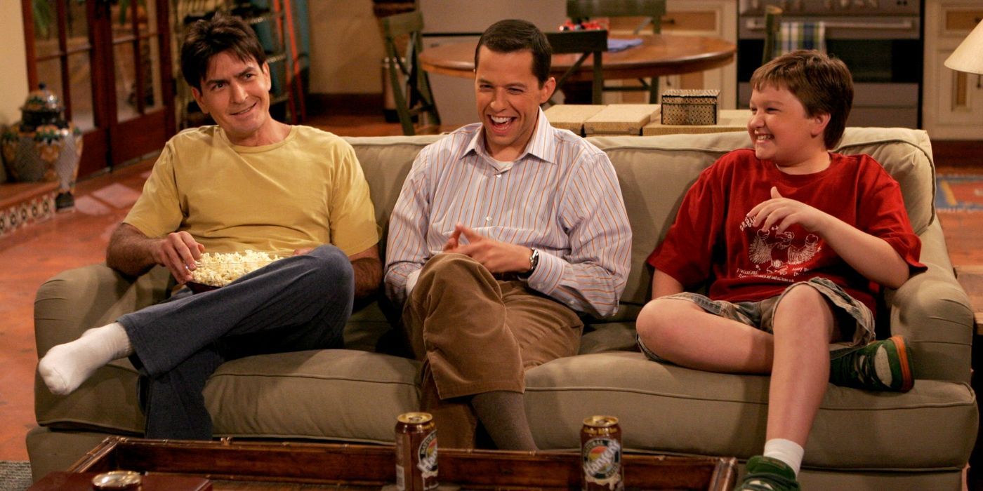 Charlie, Alan, and Jake sitting on a couch on Two and a Half Men