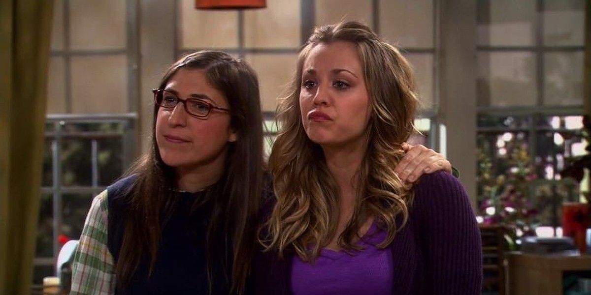 Amy hugging Penny while Penny seems annoyed on TBBT