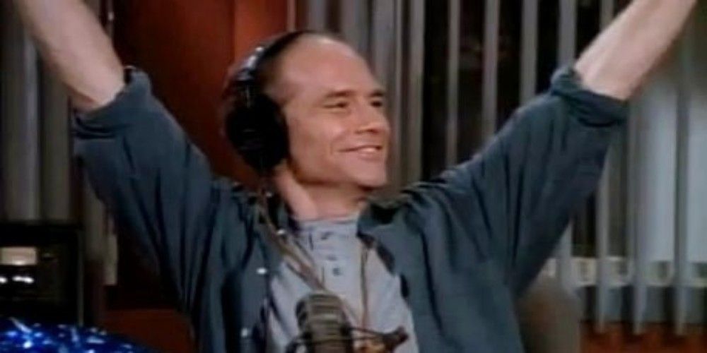 Bulldog with his arms thrown up and wearing headphones in Frasier
