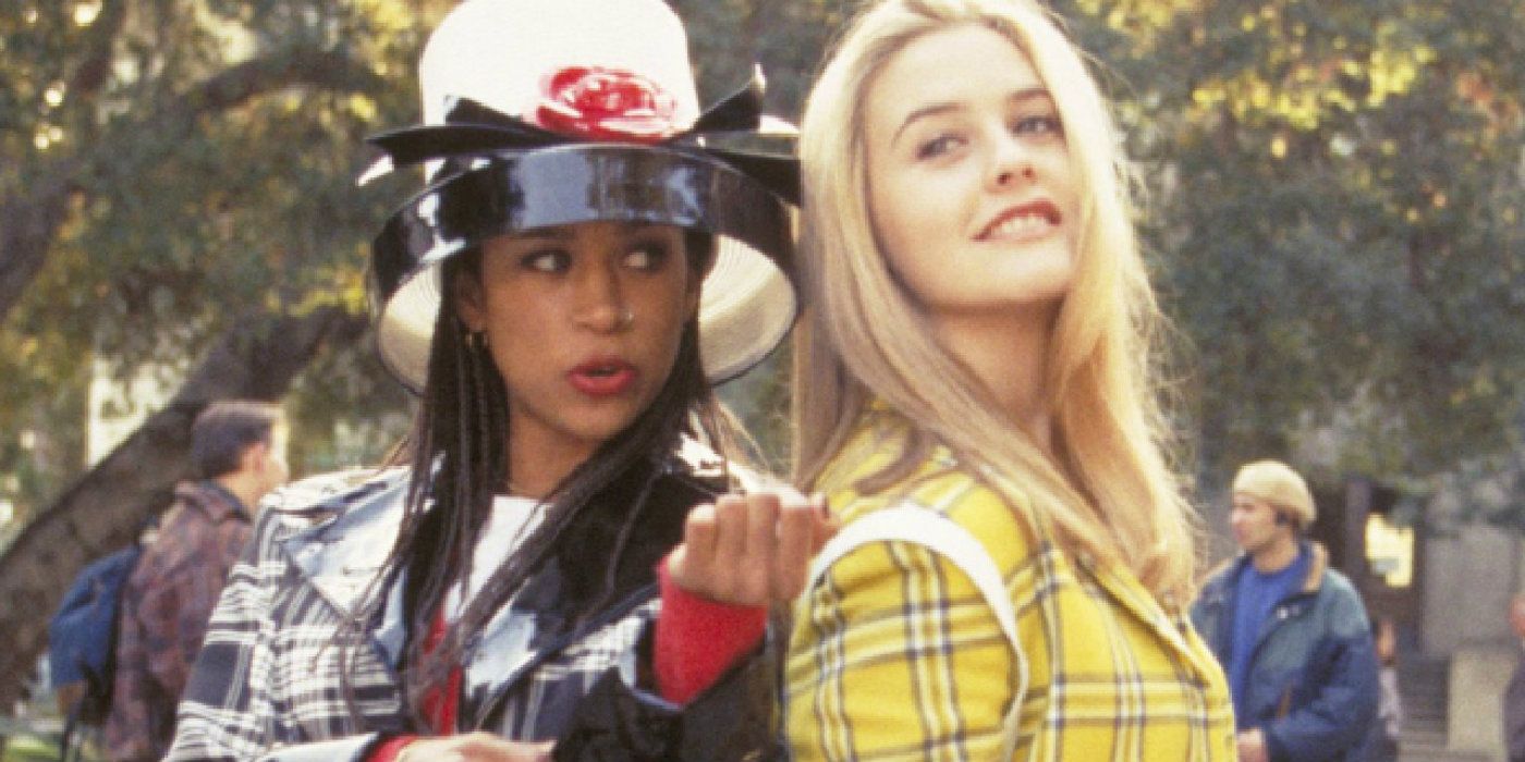 Dionne and Cher standing back to back in plaid in Clueless