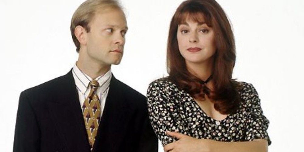 Niles looks at Daphne while she looks at the camera