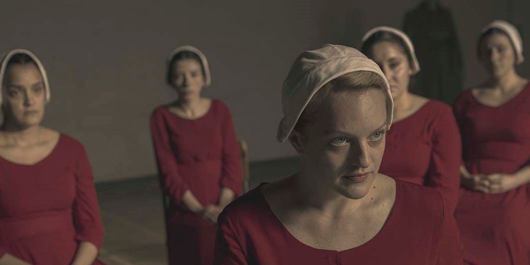 June standing in front of other handmaids, looking menacing in a scene from The Handmaid's Tale.