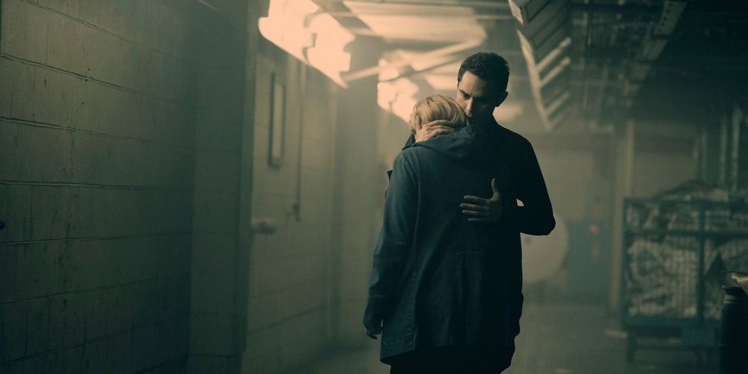 Nick embracing June in a scene from The Handmaid's Tale.