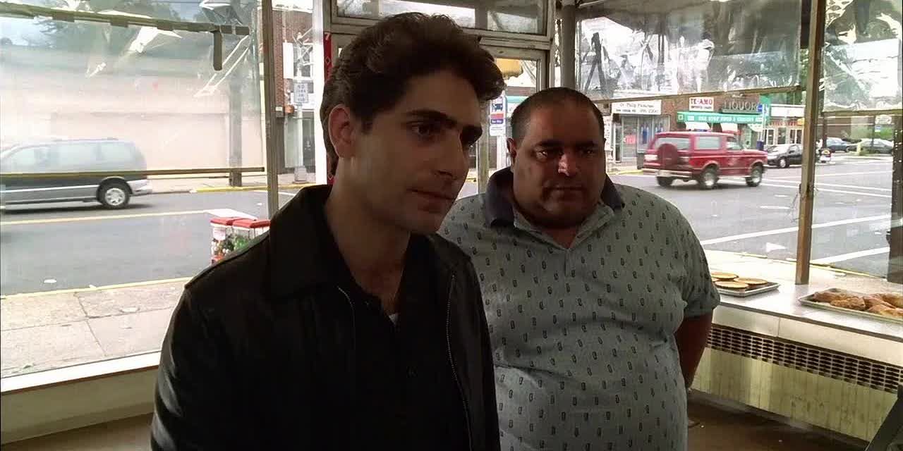 Michael Imperioli as Christopher Moltisanti standing in line at a bakery with Vito behind him in The Sopranos