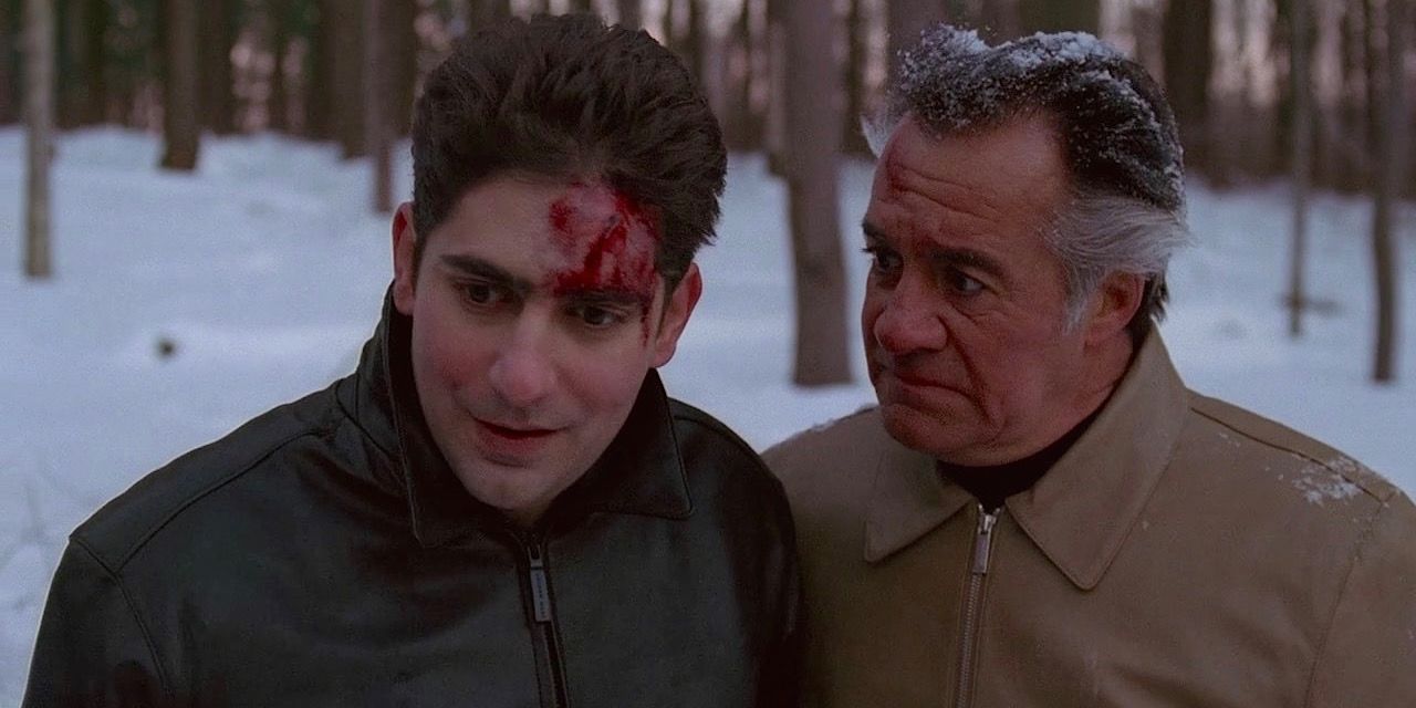 Paulie and Christopher looking bloody and beaten up in the snow in The Sopranos Pine Barrens episode