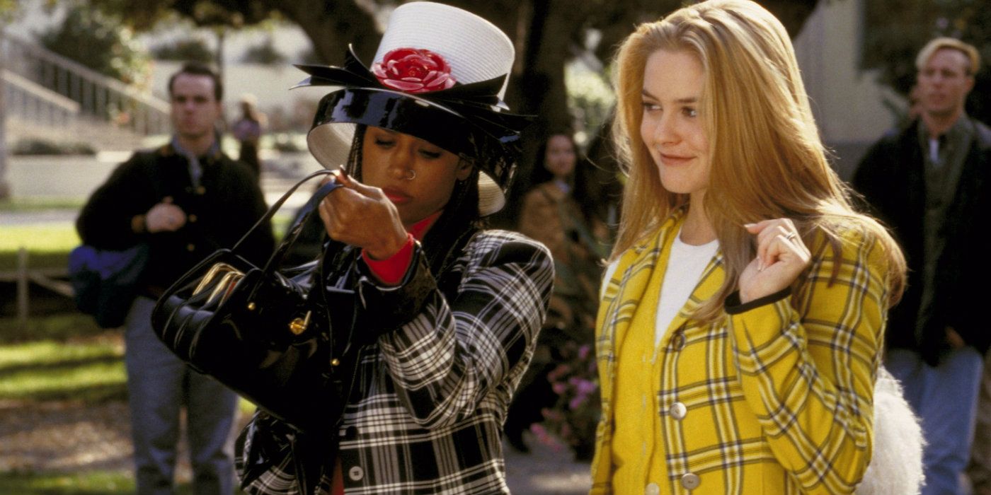 Cher and Dionne walking outside of school in plaid in Clueless