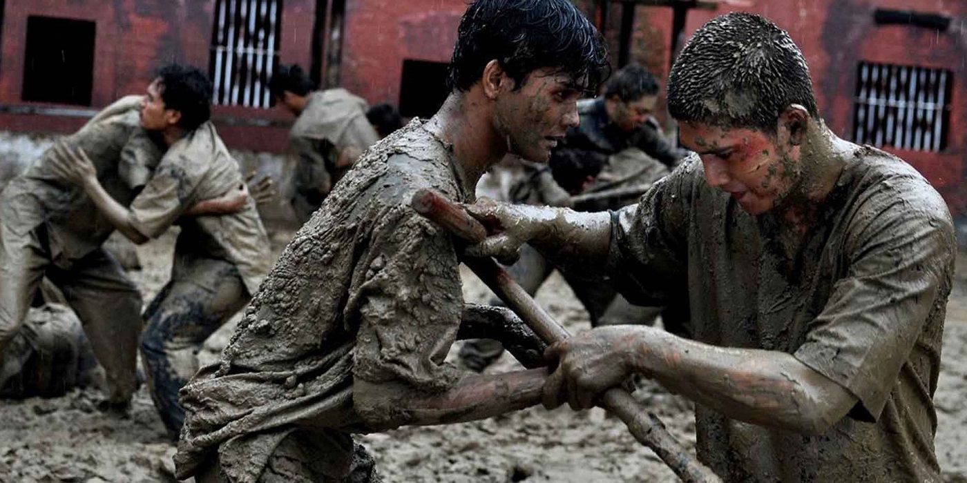 In mates a covered in mud during a prison riot in Raid: Redemption