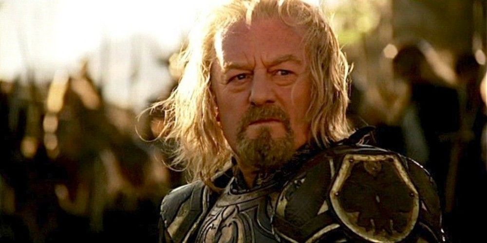 King Theoden wearing armor in front of his army in The Lord of the Rings. 