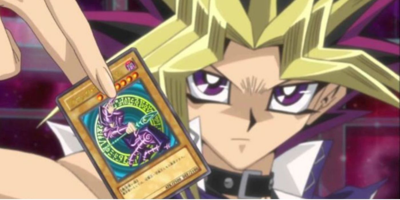 Yugi holding a card in Yu-Gi-Oh