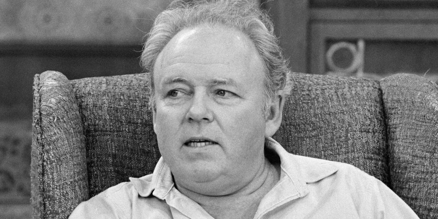 Archie from All In The Family talking in a black and white photo