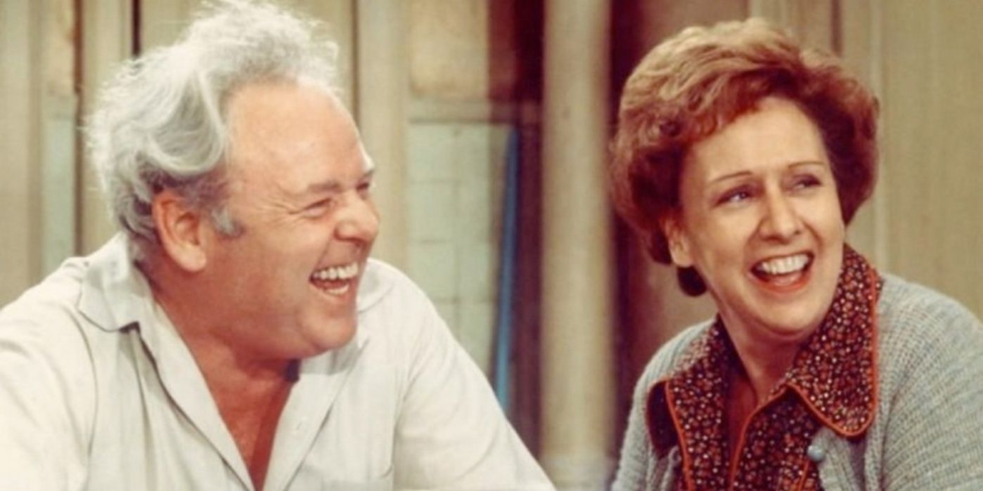 Archie and Edith laughing together in the kitchen on All In The Family