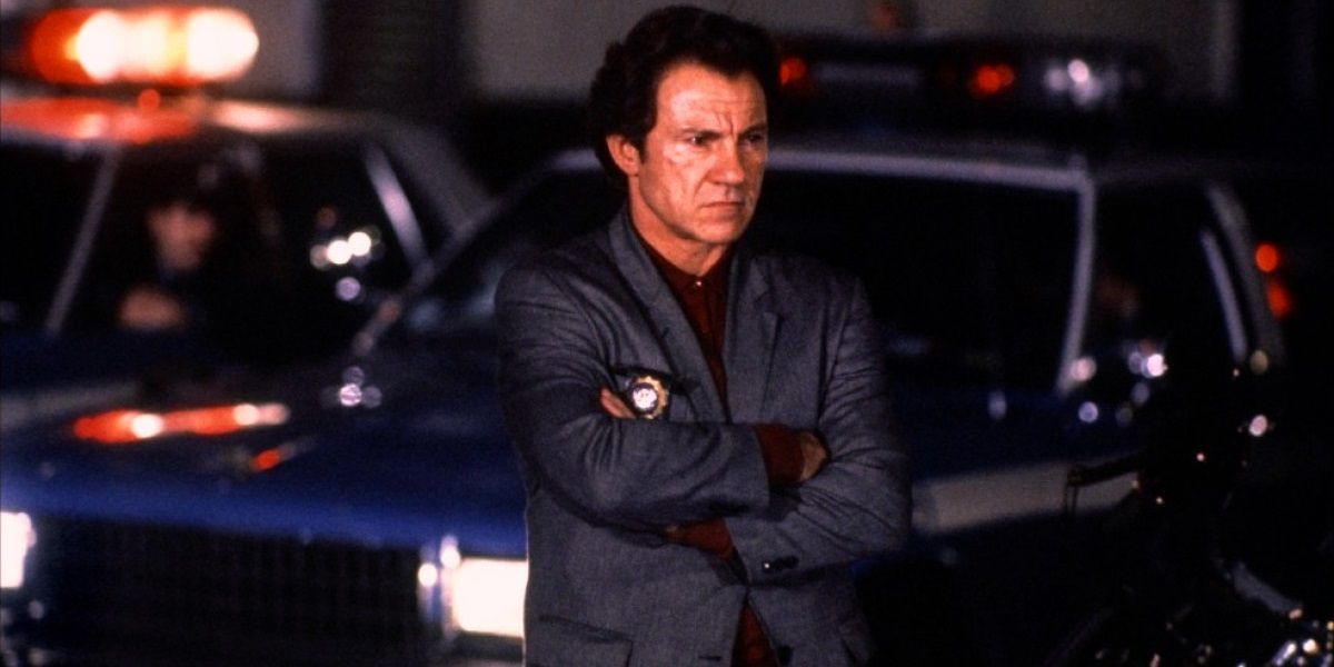Harvey Keitel standing next to a police car in Bad Lieutenant