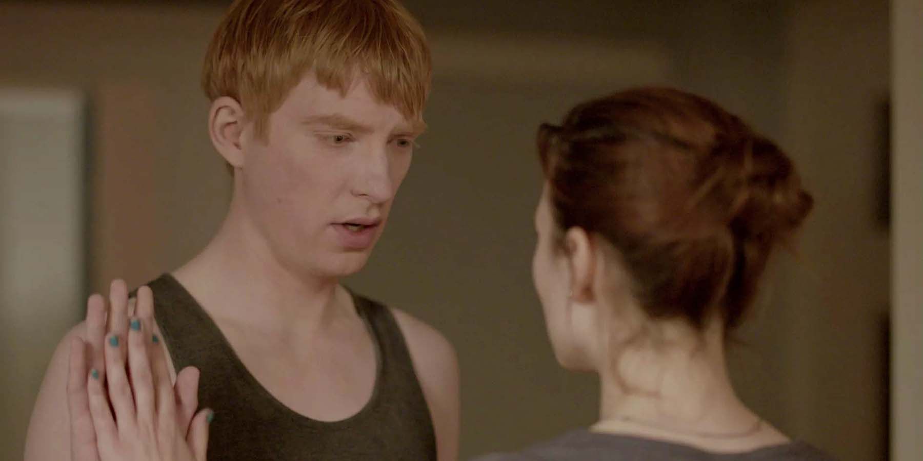 Domhnall Gleeson touching hands with Hayley Atwell in Black Mirror Be Right Back