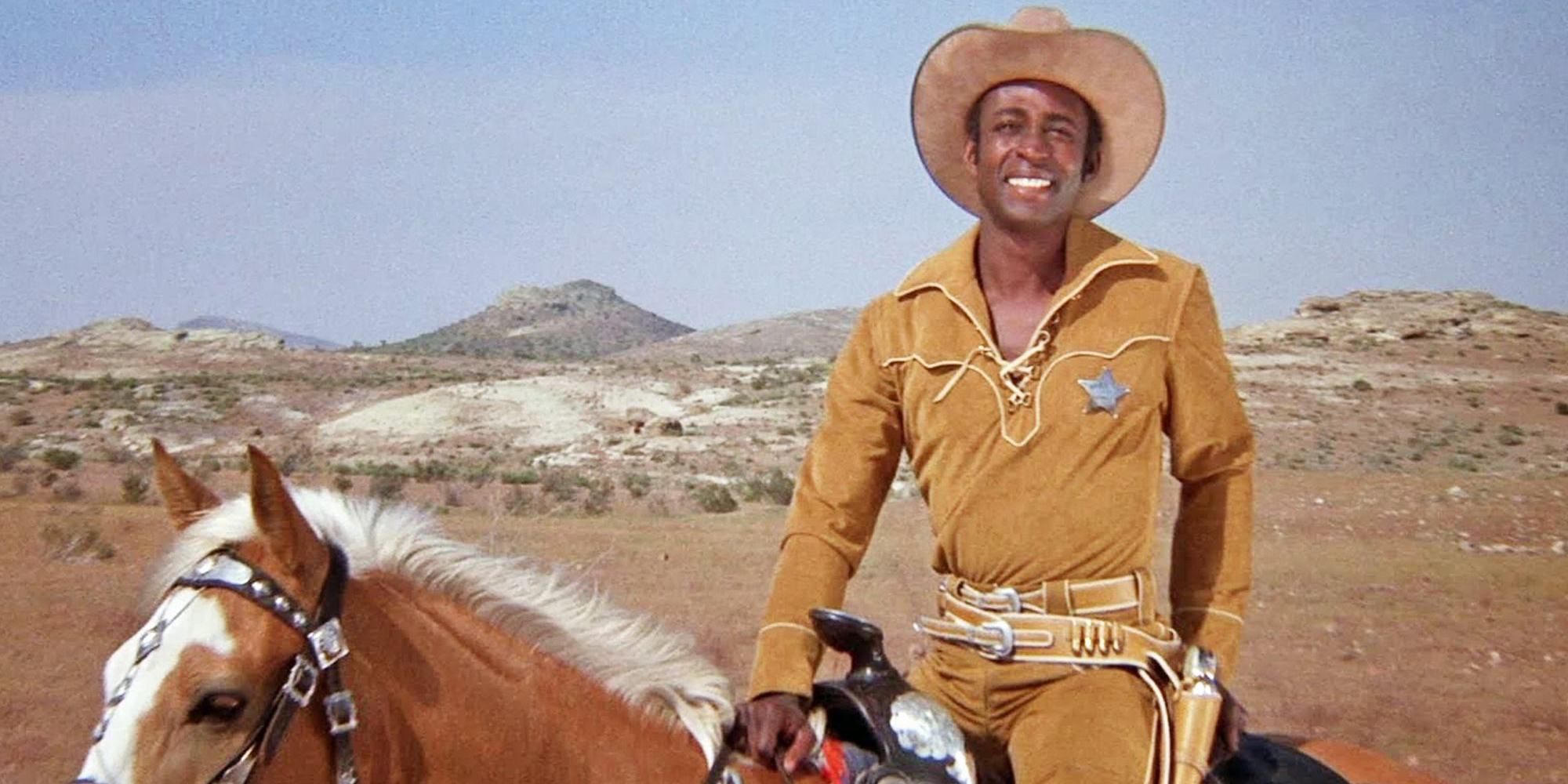 Cleavon little riding his horse in his sherrif's outifit and smiling in Blazing Saddles