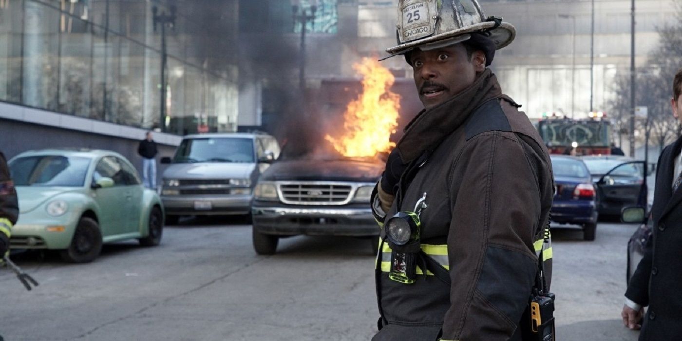 Wallace Boden standing in front of a burning truck in Chicago Fire