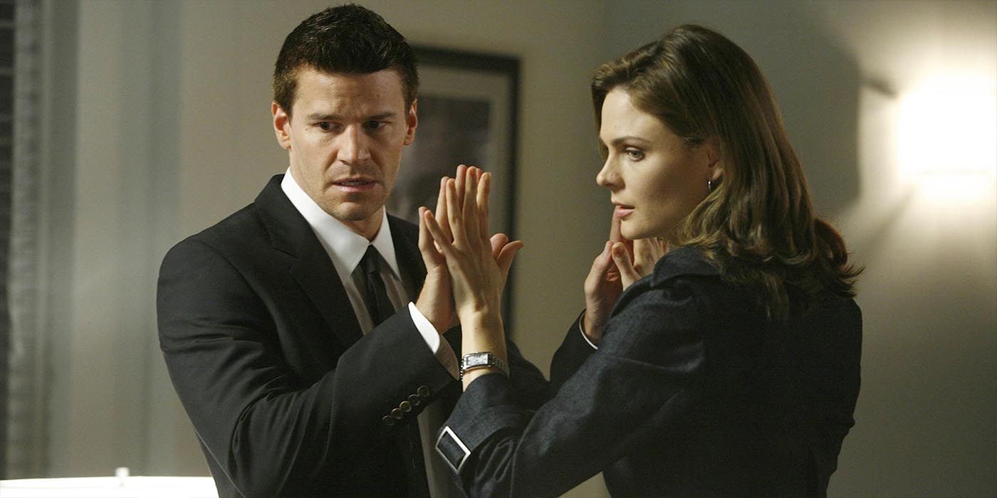 Booth and Brennan touching hands Bones 