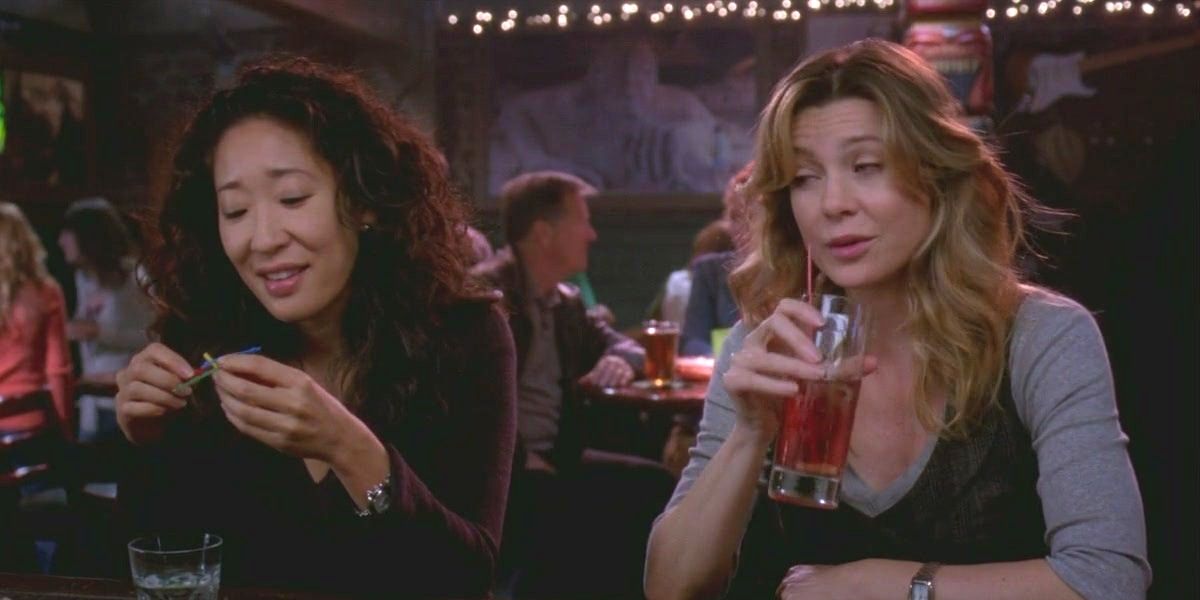 Cristina and Meredith drinking at the bar.