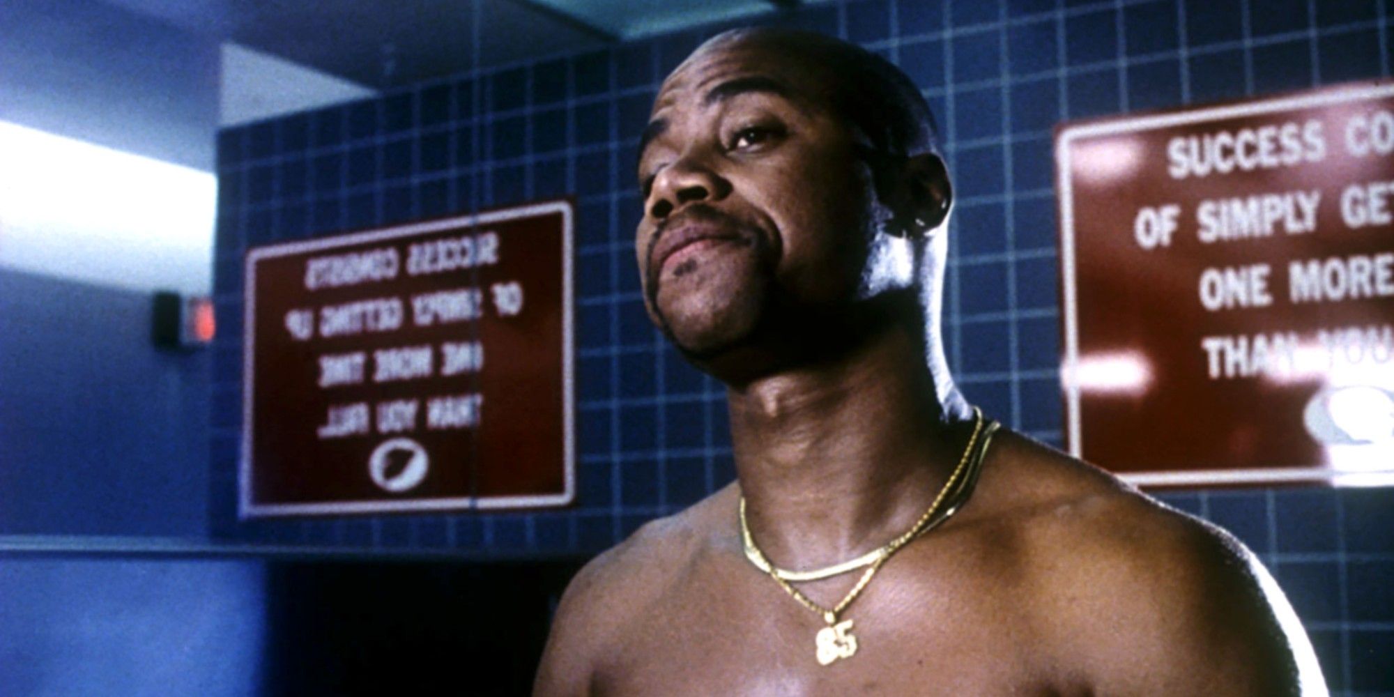 Rod standing shirtless in the locker room in Jerry Maguire