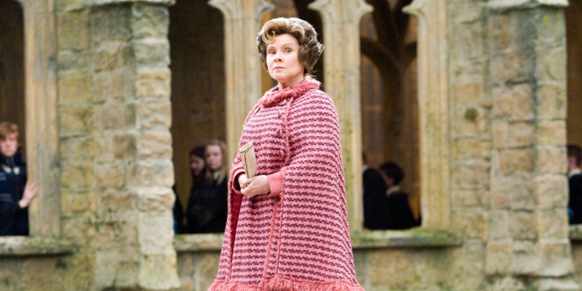 Dolores Umbridge walking in Hogwarts in Harry Potter