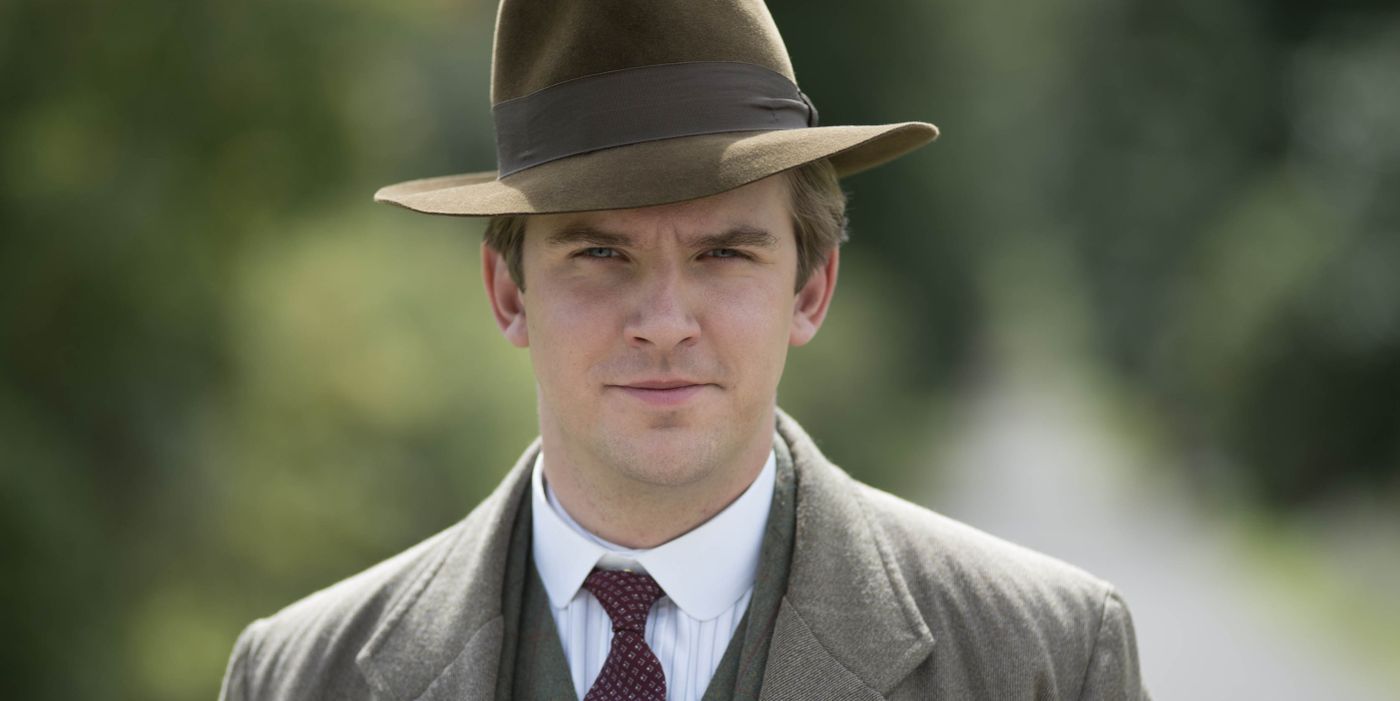 Matthew Crawley squinting and smiling softly in Downton Abbey